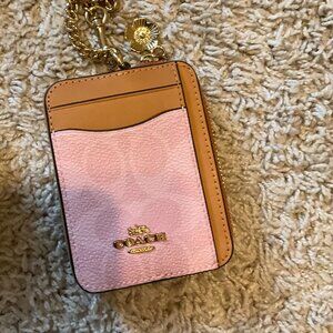 Coach zip card case In Signature Canvas With Charms. Gold/ powder pink.